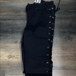 Black laced up denim jeans